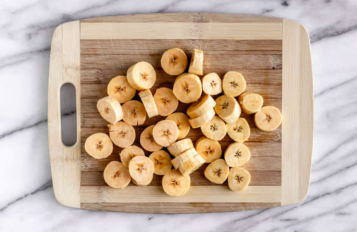 Plantain slices on a cutting board.