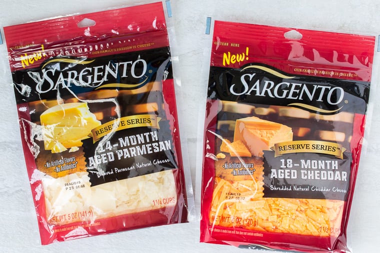 2 packages of Sargento shredded cheese on a white background
