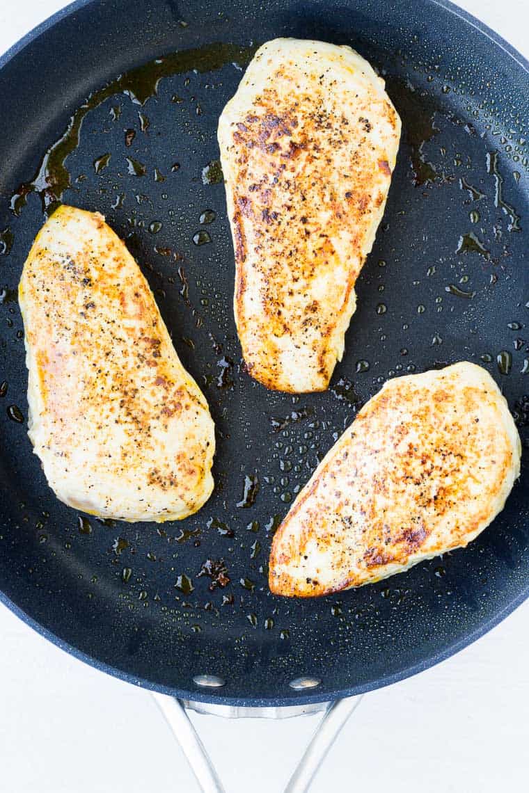 # seared chicken breasts in a black skillet