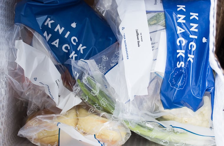 June 2019 Blue Apron Box opened up to show packaging of food items in plastic bags