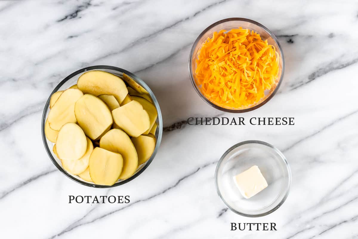 Ingredients needed to make grilled cheesy potatoes with text overlay.