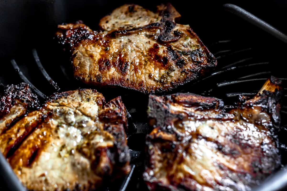 Grilled pork chops on a grill.