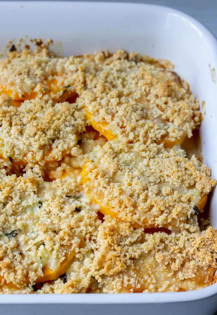 Close up of Butternut Squash Gratin in a white baking dish