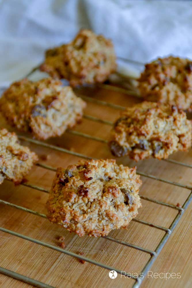 Peanut Butter Coconut Cookies on a cooling rack over a wood table