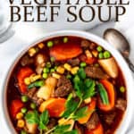 Vegetable beef soup in a bowl with text overlay.