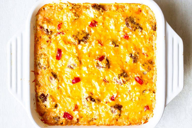 Baked Italian Sausage Casserole in a white, square casserole dish on a white background