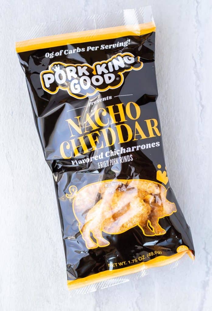 Pork rinds in a bag on a white background