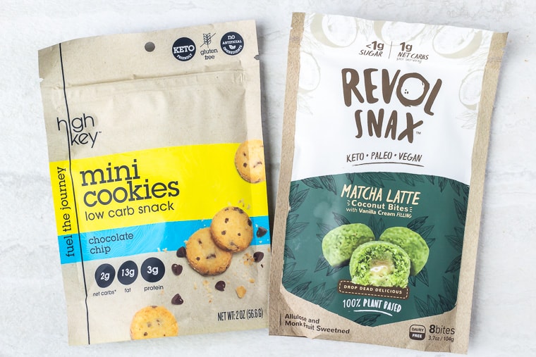 Revol Snax bag of Matcha Latte Coconut Bites and a bag of highkey mini chocolate chip cookies on a white background