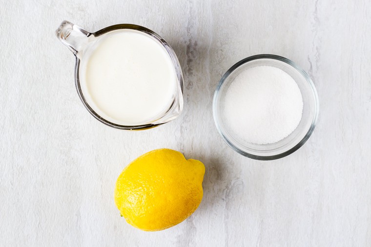 Ingredients for lemon cream on a white background