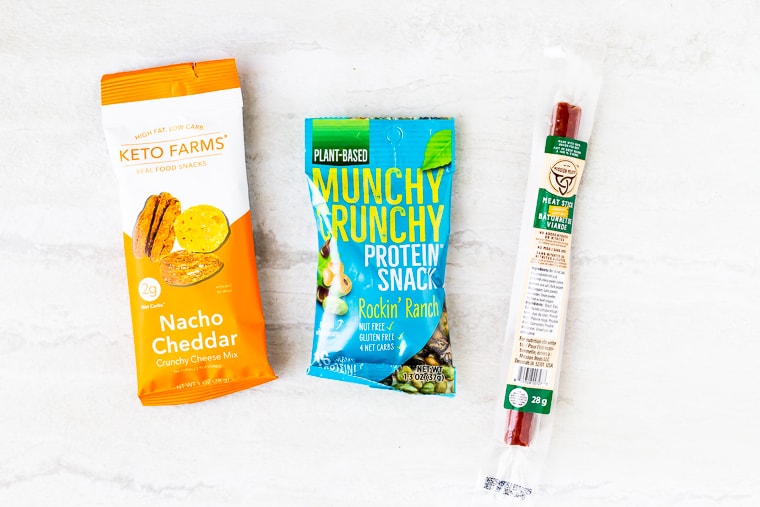 3 packages of keto snacks on a white background