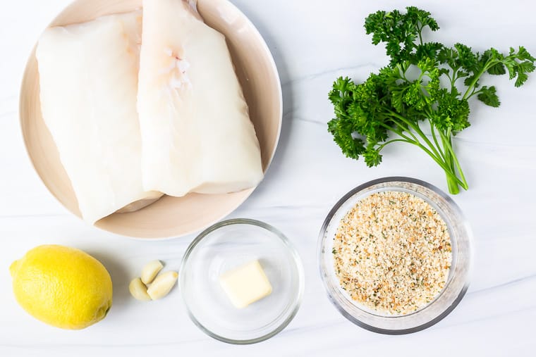 Ingredients for crispy baked cod on a white background