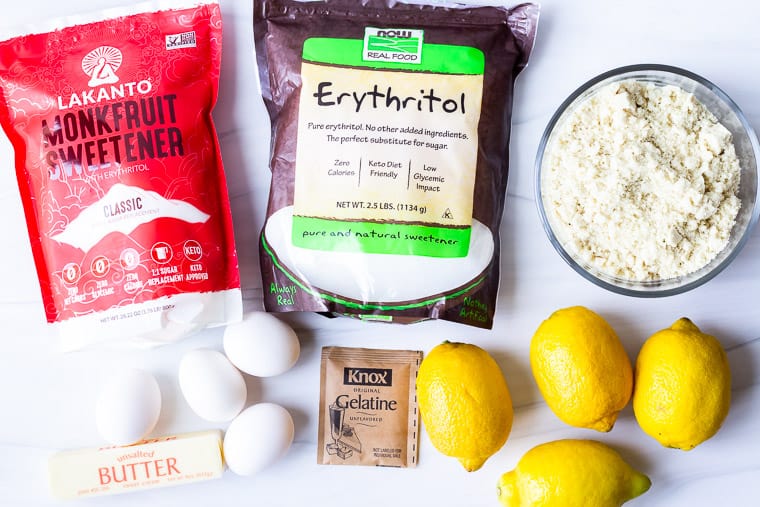 Ingredients needed to make keto lemon bars on a white background