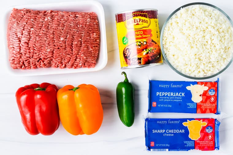 Ingredients to make a keto mexican casserole on a white background