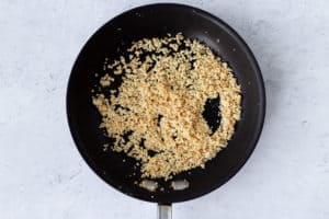 Toasted almond flour crumbs in a skillet