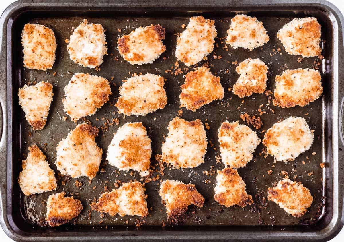 Homemade baked chicken nuggets on a baking sheet