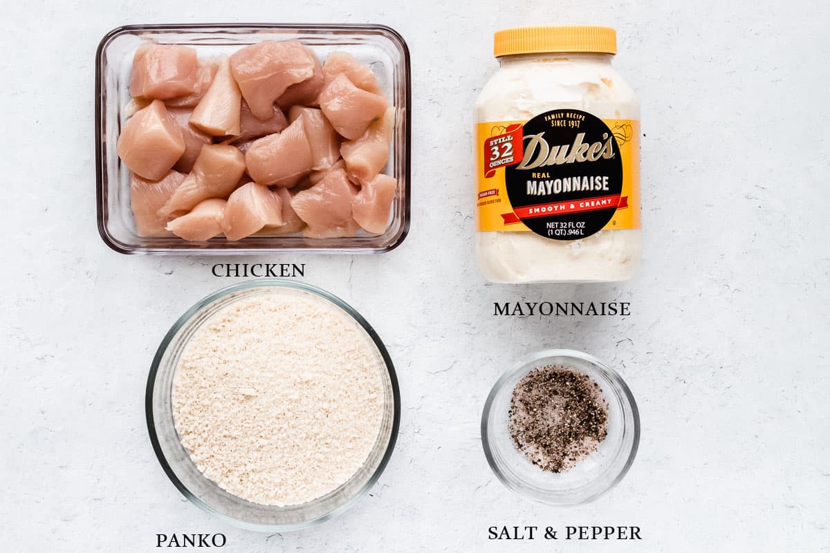 Ingredients to make mayonnaise chicken nuggets on a white background with labels