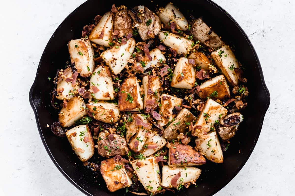 Bacon roasted potatoes with mustard seeds, shallots, and parsely