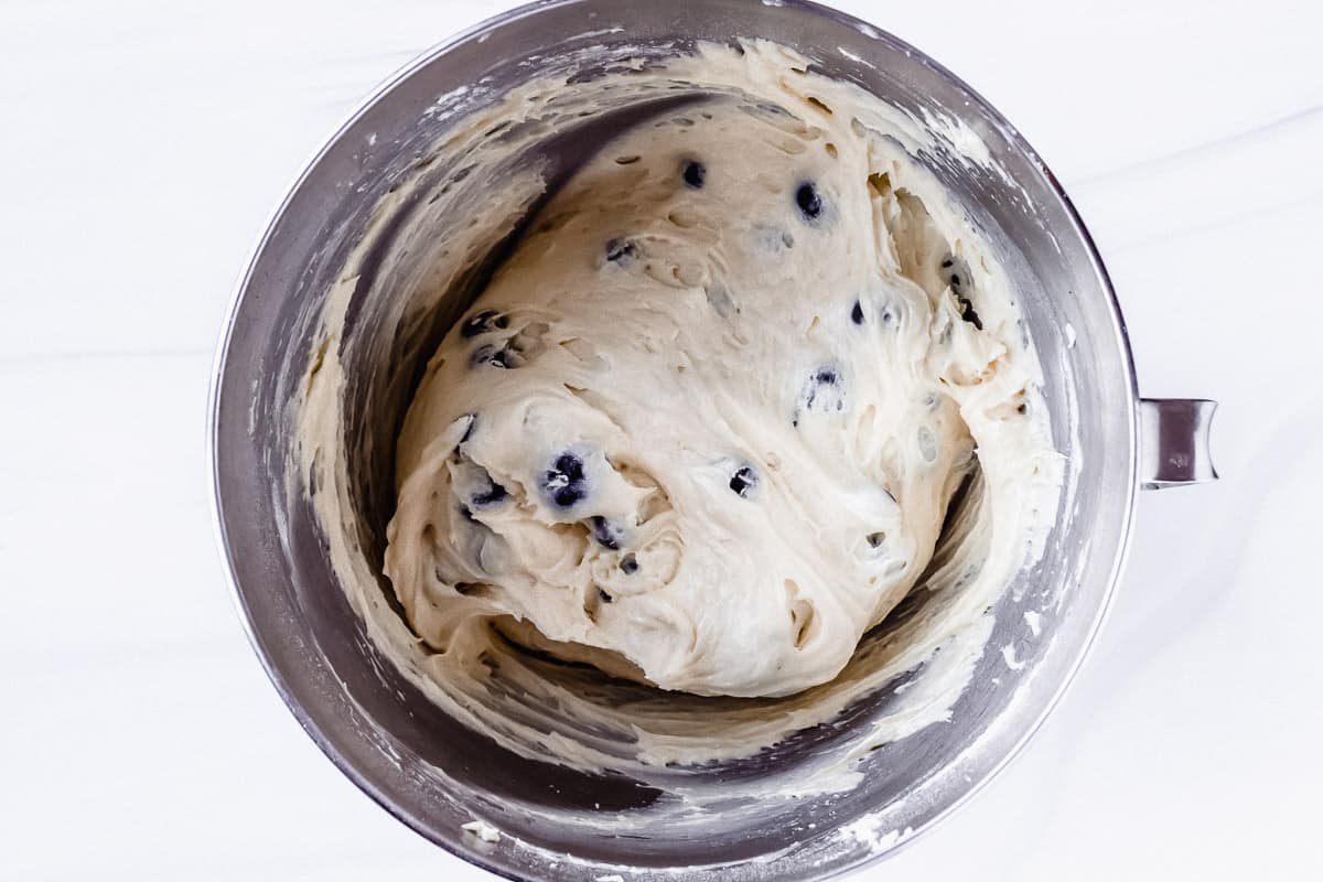 Blueberry pound cake batter in a silver mixing bowl