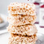 Rice krispies treats with cranberry seeds with text overlay