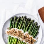Broiled asparagus with cheese sauce with text overlay