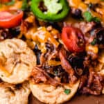 close up of pulled pork nachos on plantain chips