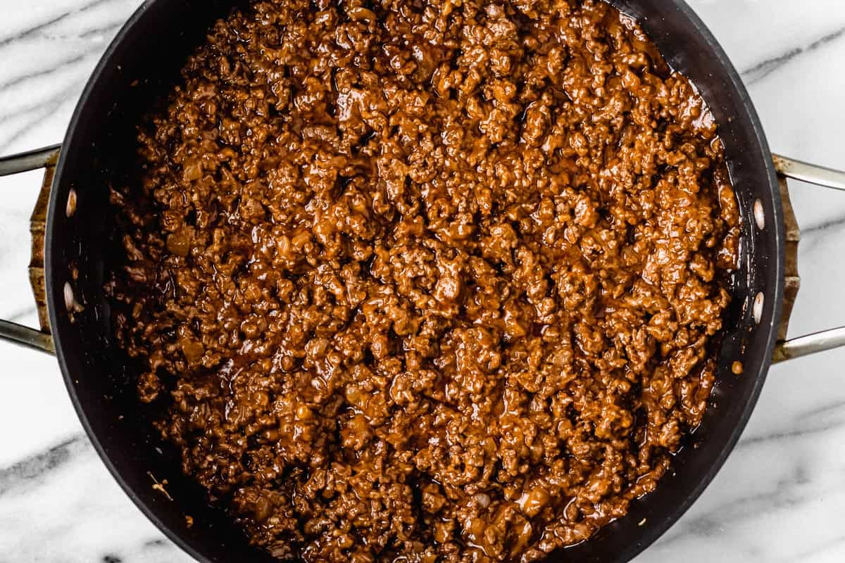 Barbecue ground beef in a black skillet