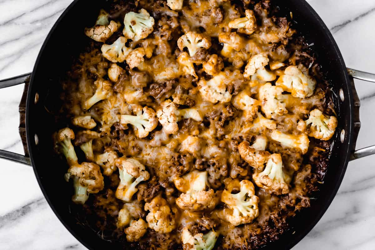 Baked barbecue ground beef and cauliflower skillet in a black pan