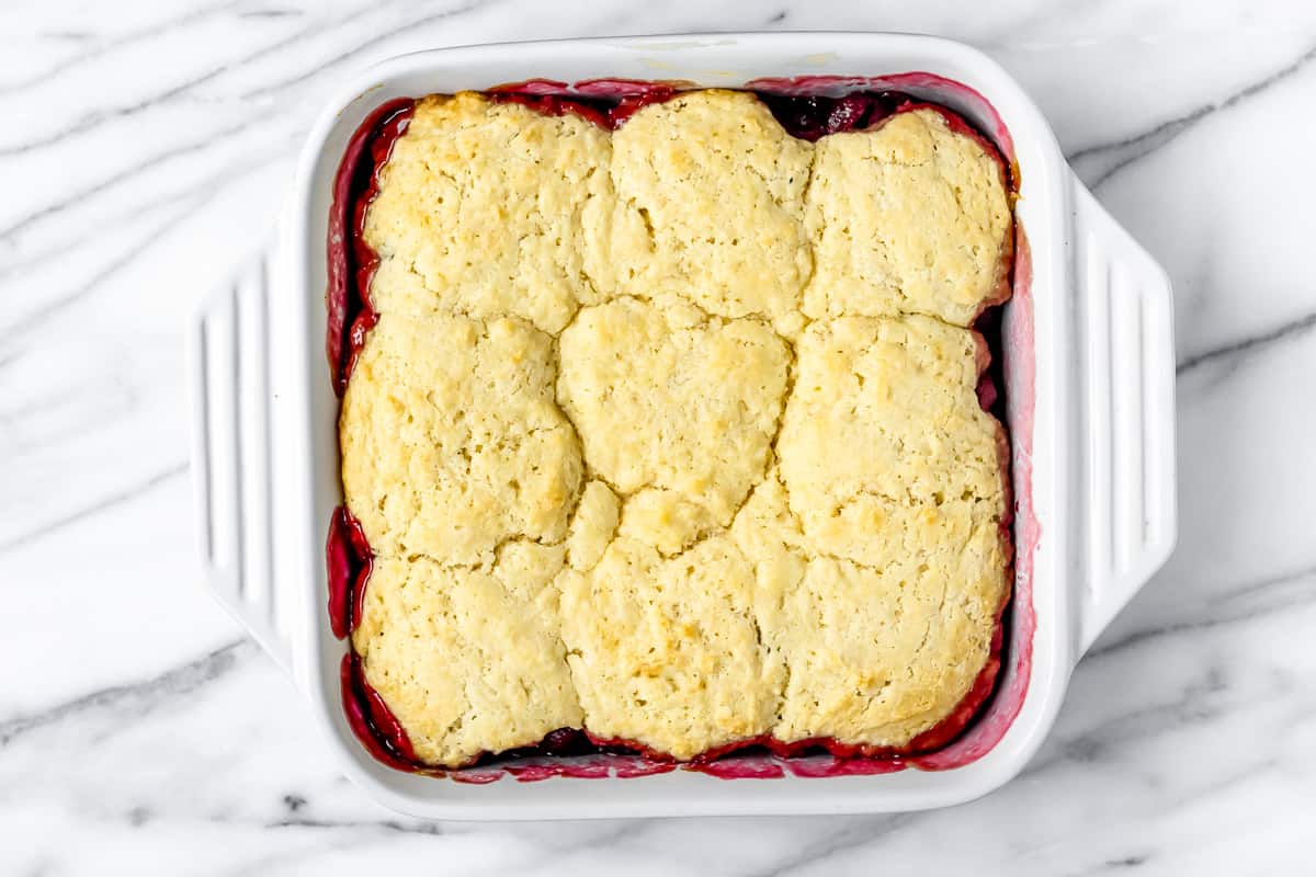 Baked cherry cobbler with drop biscuit dough on top