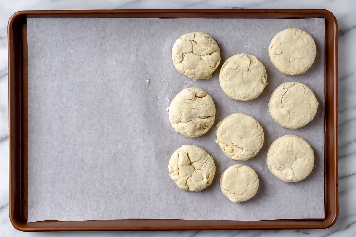 9 biscuits on a parchment paper lined baking sheet