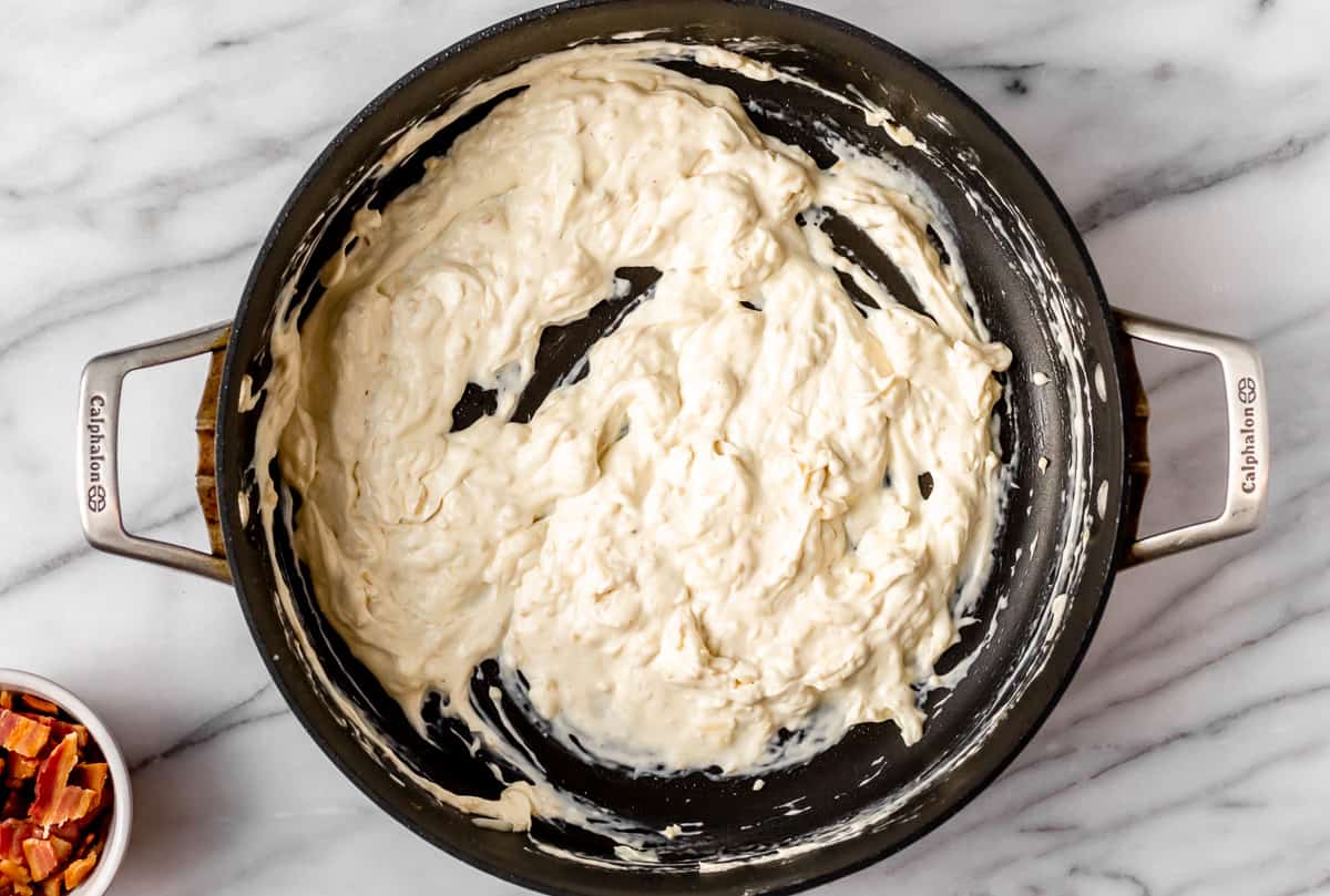Cream cheese ranch sauce in a black skillet
