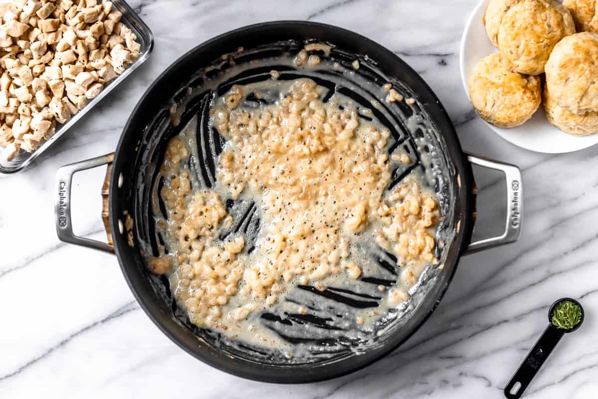 Onions, butter and flour roux in a black skillet