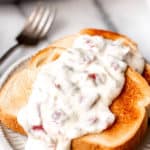 Creamed chipped beef over toast with text overlay.
