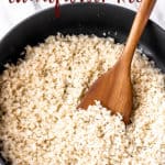A skillet of garlic cauliflower rice with text overlay.