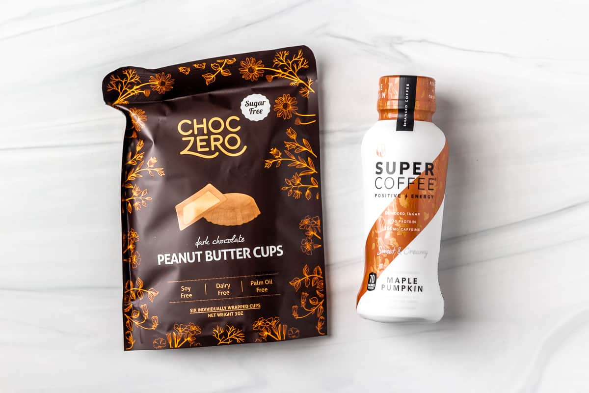 Choc Zero Dark Chocolate Peanut Butter Cups package and a bottle of super coffee.