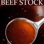 Close up of homemade beef stock with text overlay.