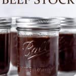 Jars of homemade beef stock with text overlay.