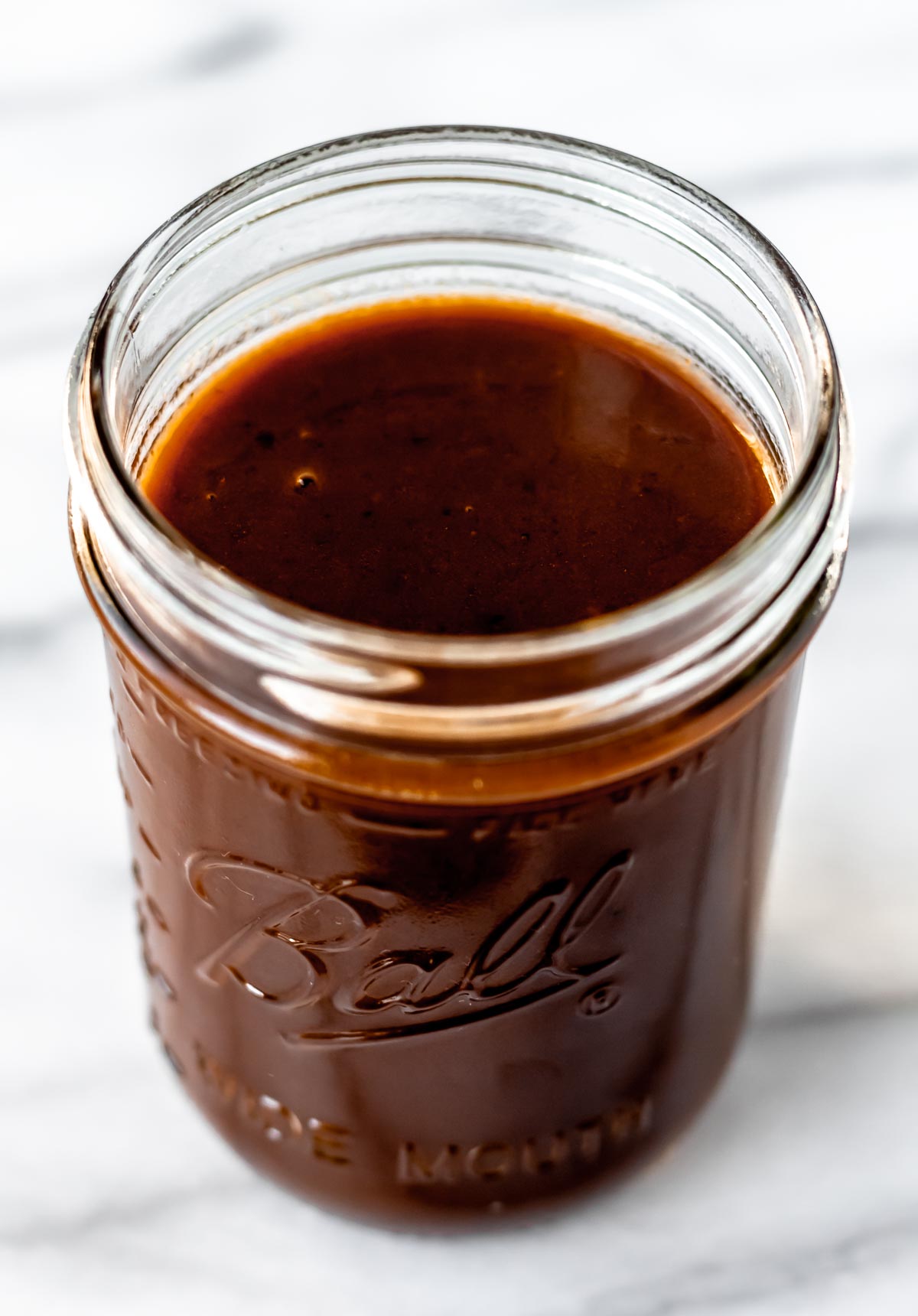 Demi-glace in a glass canning jar.