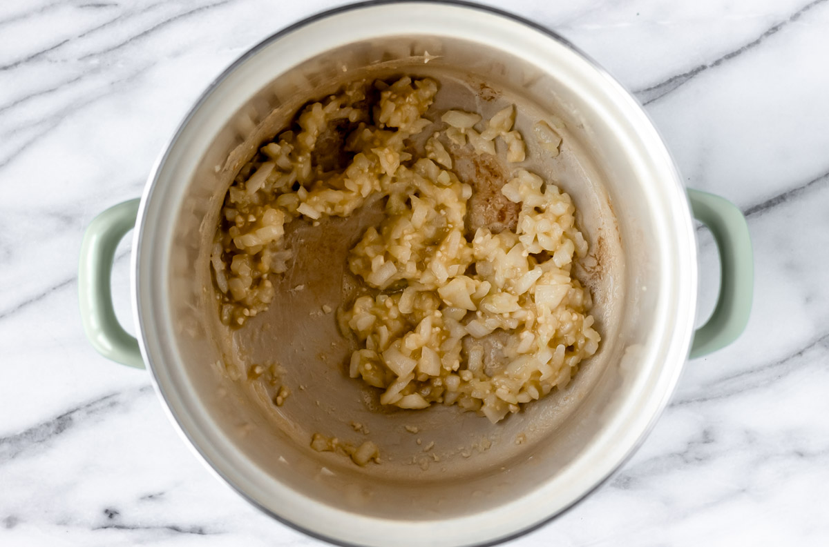 Onions and garlic in a roux in the bottom of a stock pot.