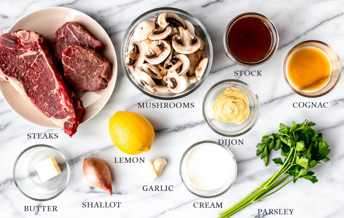 Ingredients needed to make Steak Diane on a marble background with text overlay.
