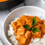 Butter paneer on a plate of rice and in a pan with text overlay.