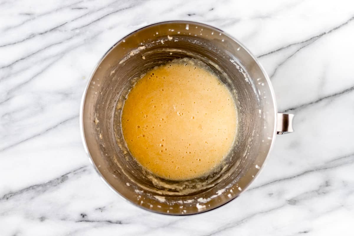 Butter, sugar, eggs and vanilla combined in a mixing bowl.