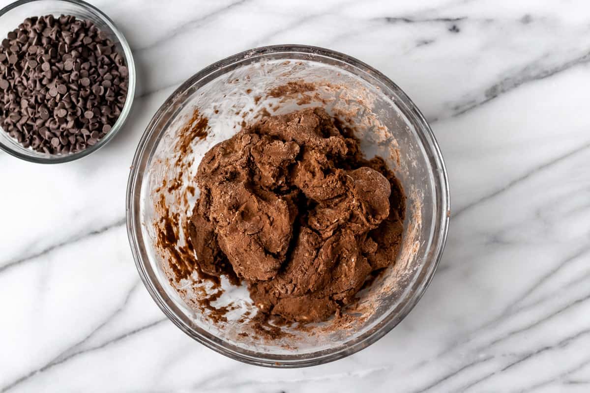 Chocolate scone dough in a glass bowl.