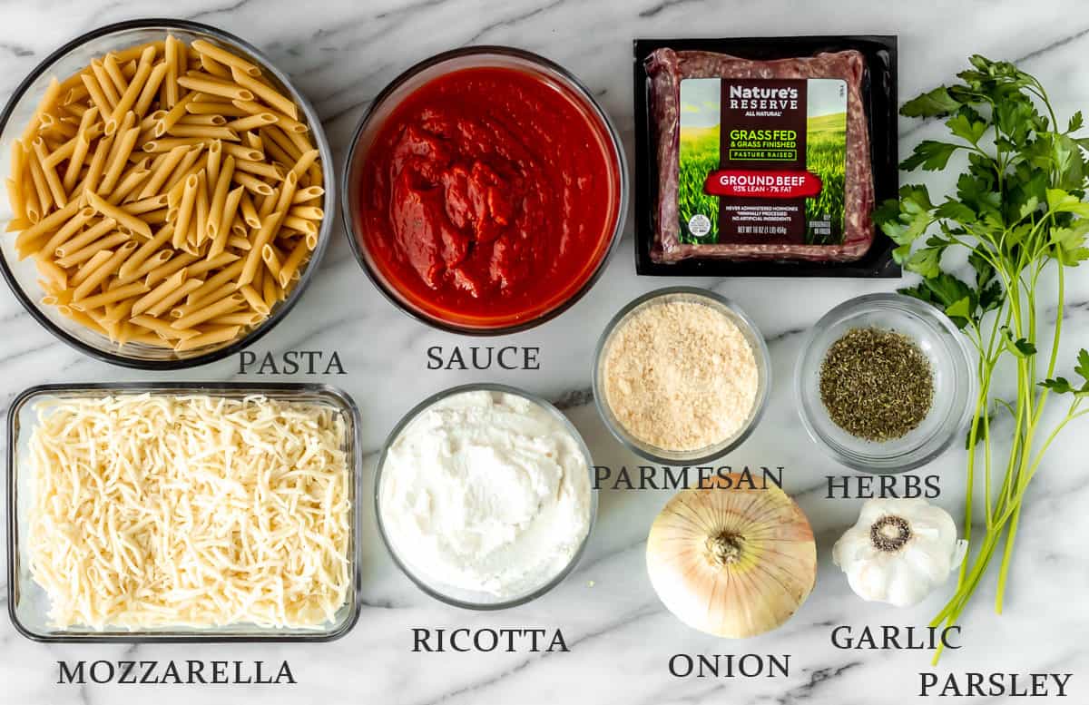 Ingredients needed to make baked ziti with text overlay.