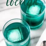 Two blue pineapple cocktails with text overlay.