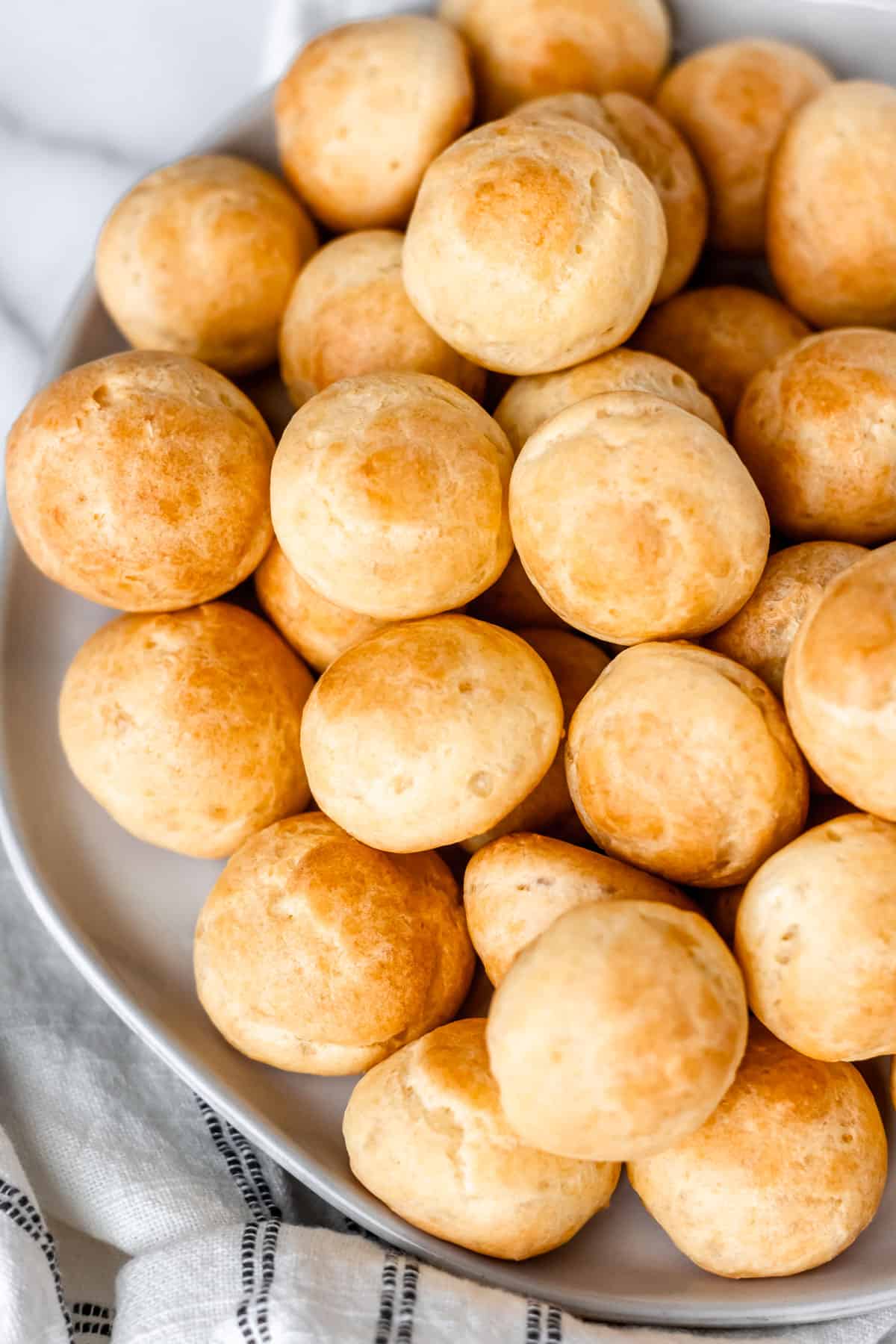 Close up of a plate of gougeres.