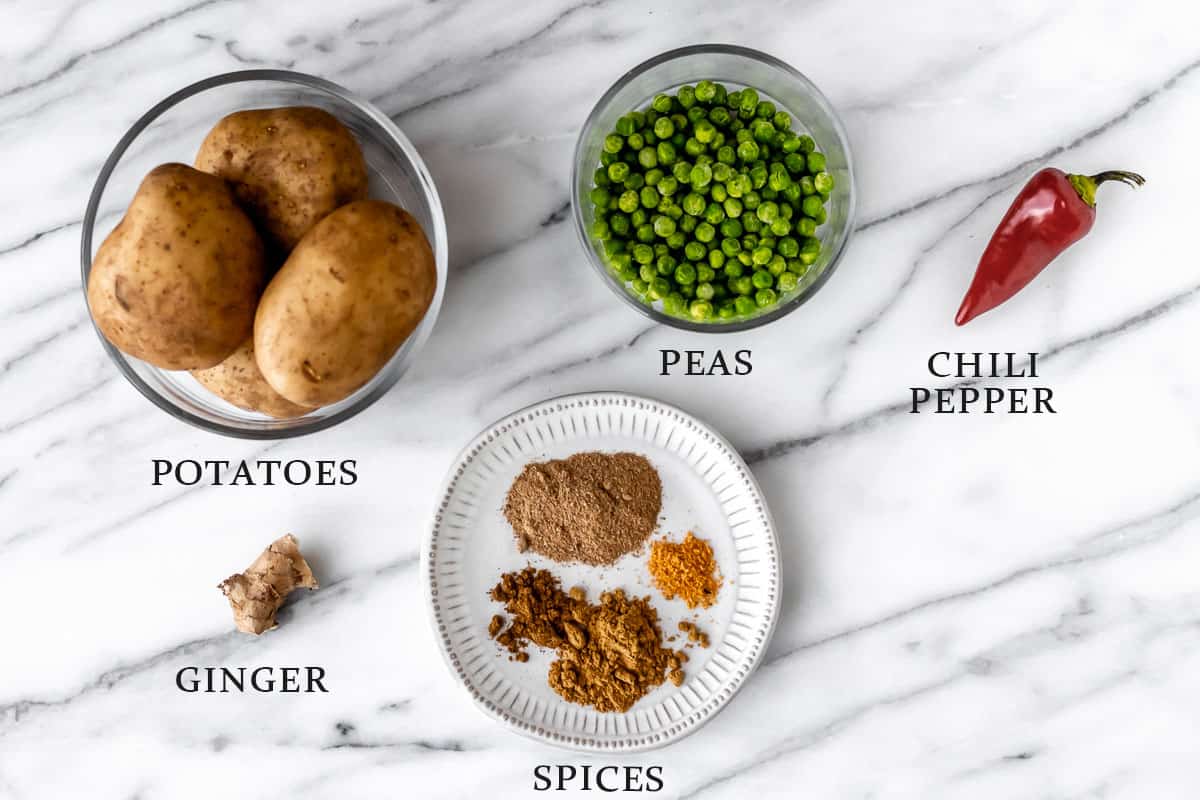 Ingredients to make a vegetarian samosa filling with text overlay.