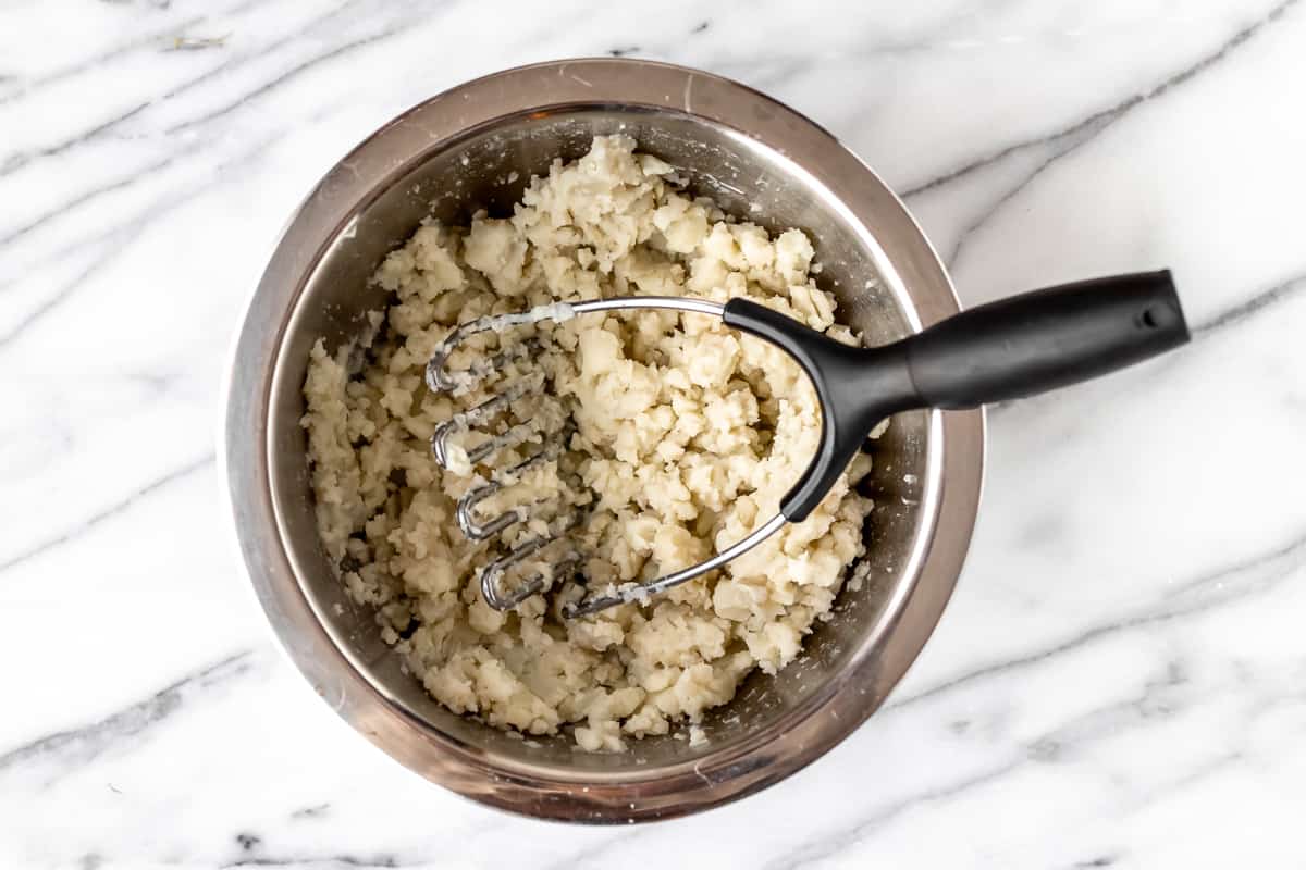 Mashed potatoes in a silver bowl.