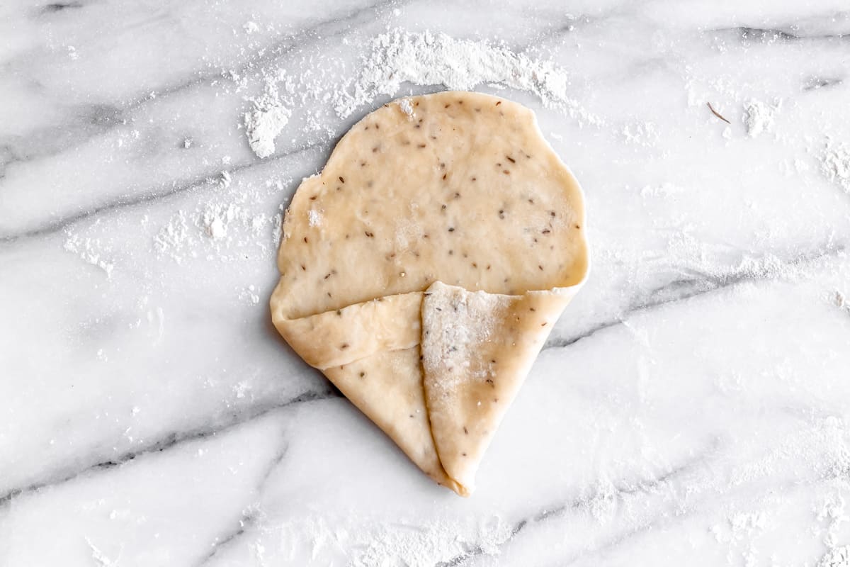 Samosa dough folded to create a cone shape.