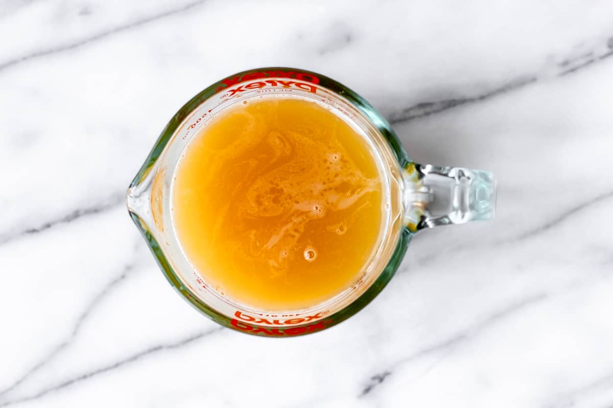 Overhead of manmosa ingredients combined in a measuring cup.