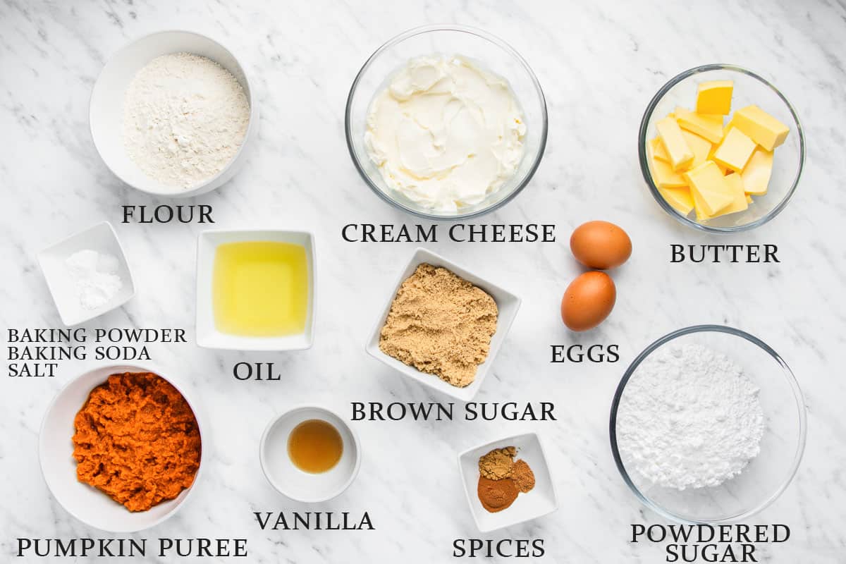 Ingredients for pumpkin cupcakes on a white background with text overlay.